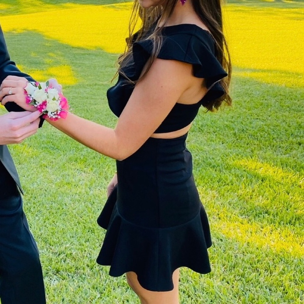 Adorable mini dress with cut outs and ruffle trim on the bottom!! - Picture 3 of 4